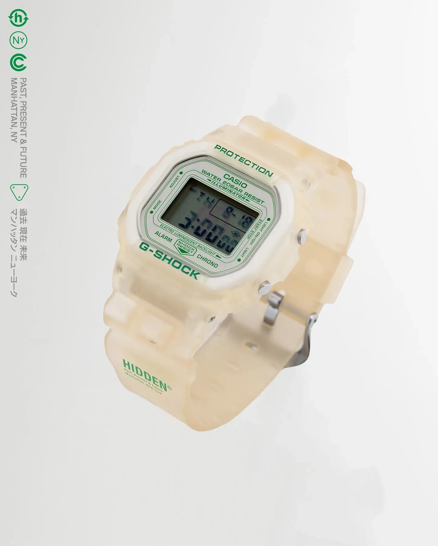 Translucent off-white Casio G-Shock watch with green HIDDEN branding floating against a pale grey background
