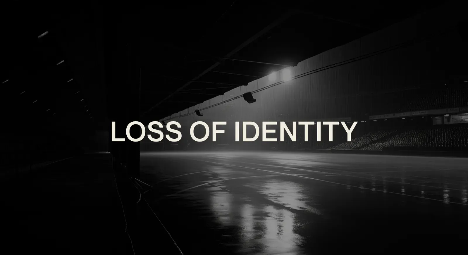 Caption LOSS OF IDENTITY over a dark empty arena with a wet reflective floor