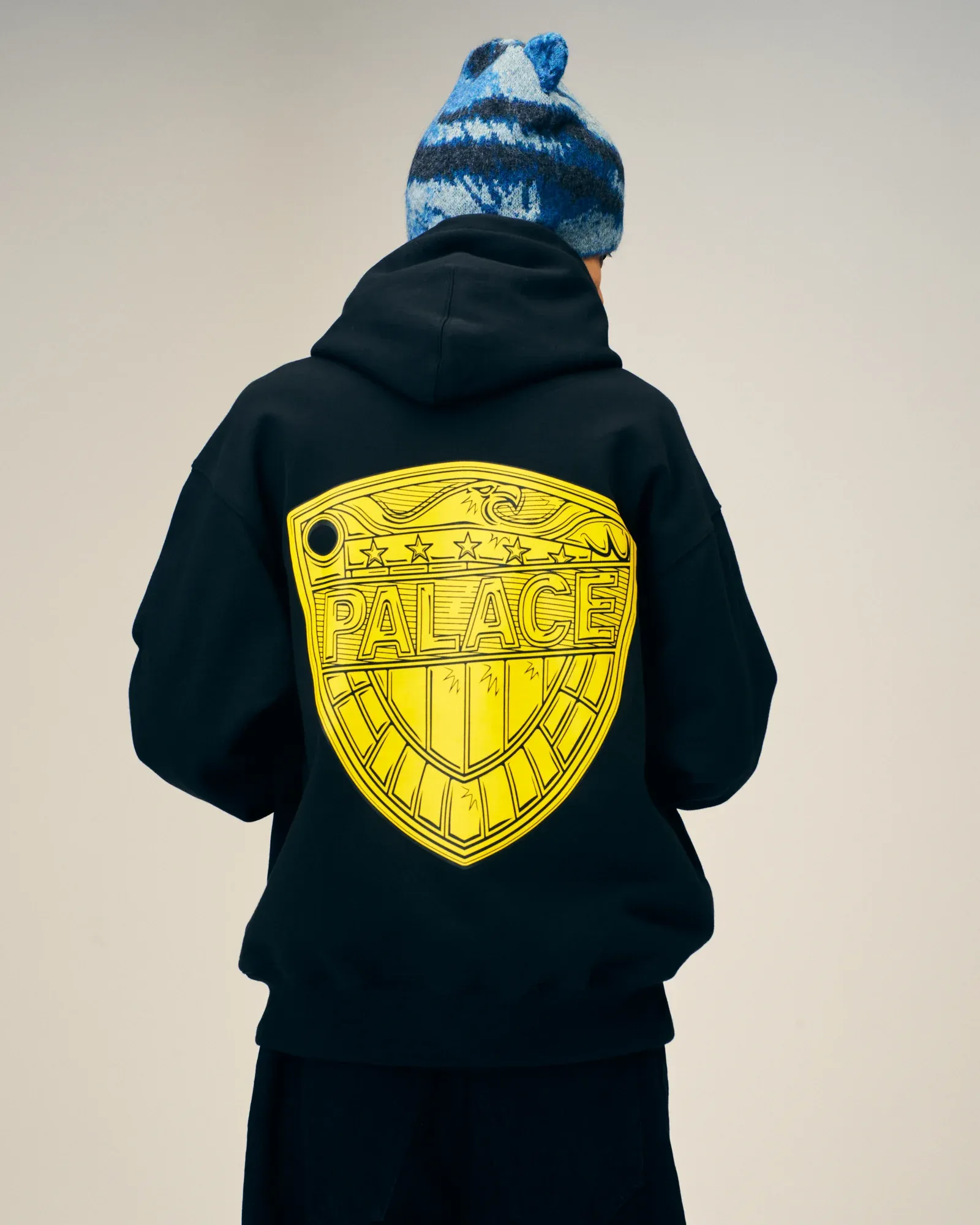 Back of Palace’s black Judge Dredd hoodie with the Judge badge