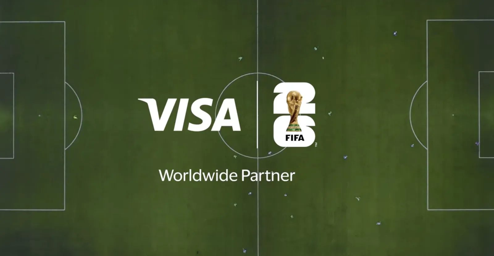 Visa and FIFA World Cup 26 logos with the words Worldwide Partner over an aerial view of a football pitch
