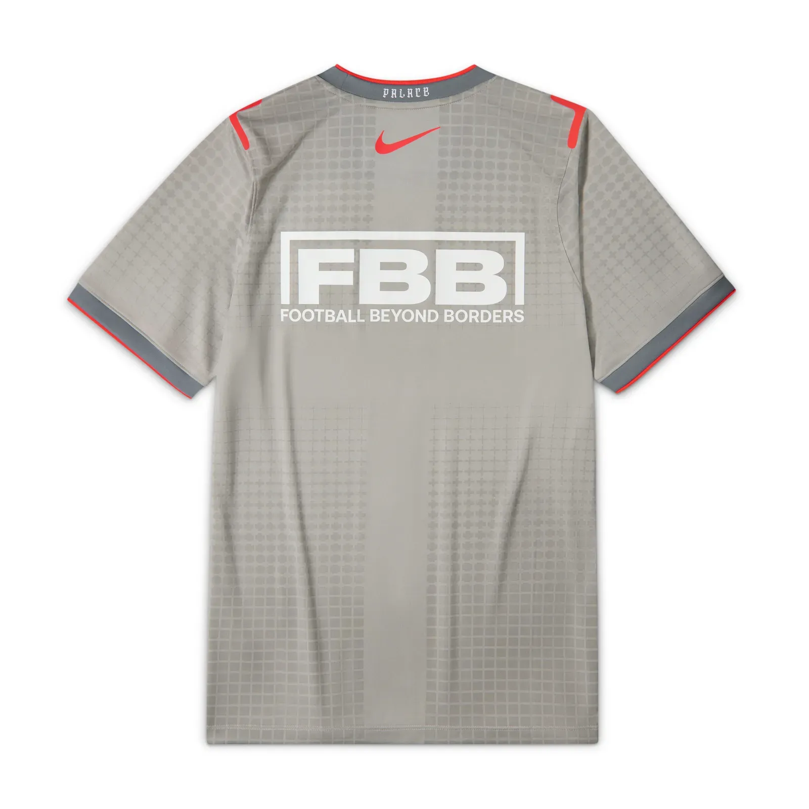 England’s grey Nike x Palace warm-up shirt, the back printed with the Football Beyond Borders charity logo