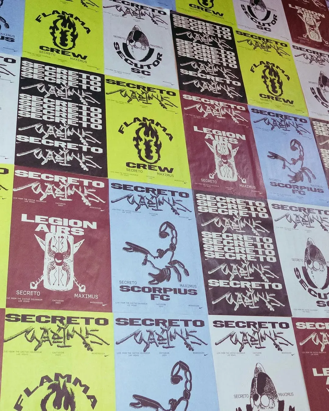 Wall of Secreto Maximus posters for Flamma Crew, Secutor SC, Legion Airs and Scorpius FC, live from the Cactus Colosseum