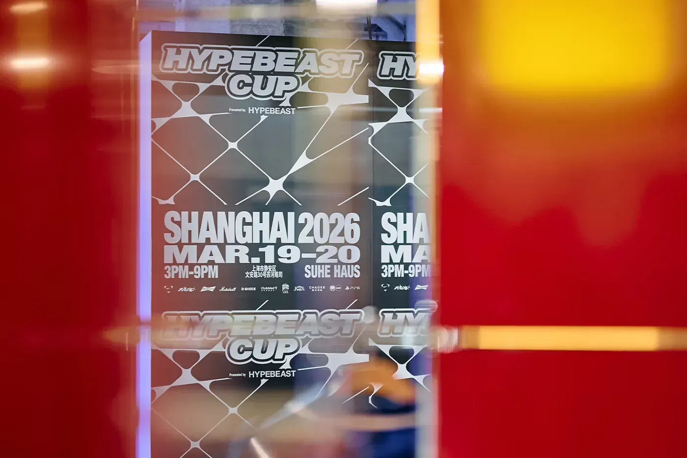 Hypebeast Cup Shanghai 2026 poster for March 19 to 20 at Suhe Haus, seen through blurred red and yellow glass