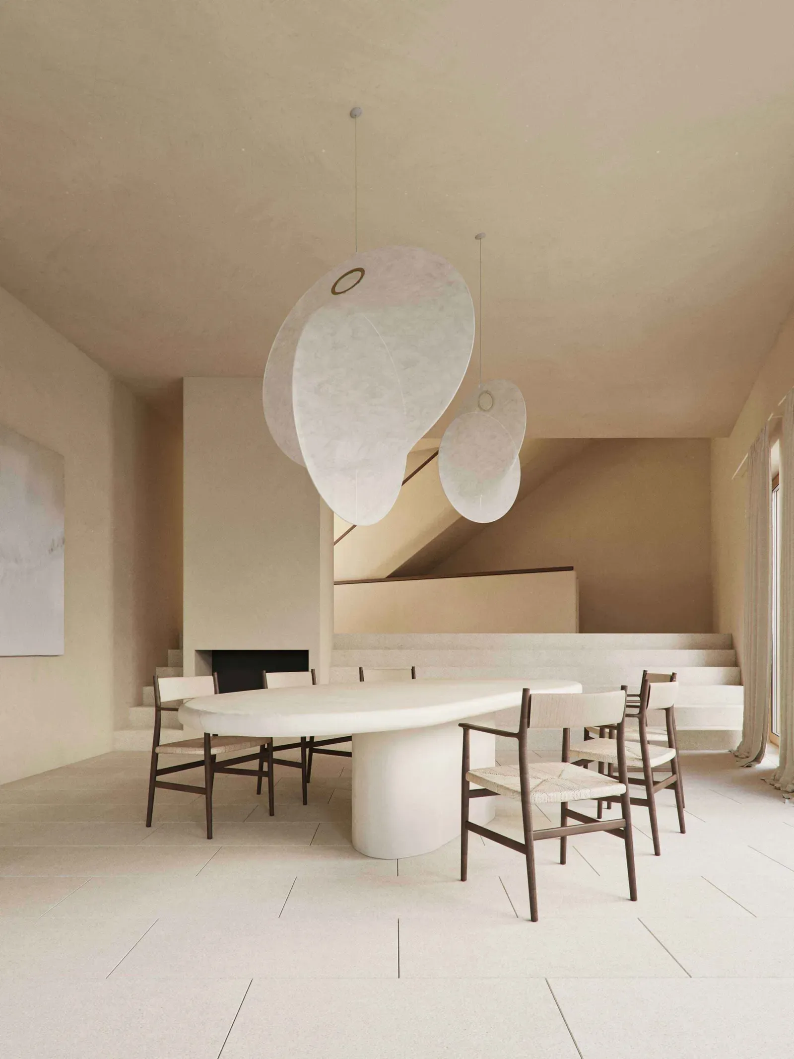 Dining room with a curvy white table, dark wood chairs with woven seats and two large white disc pendant lamps